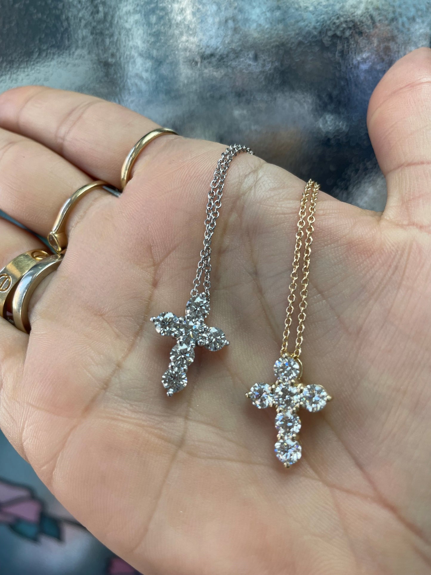 The Mallory Cross Pendant Small in hand comparison