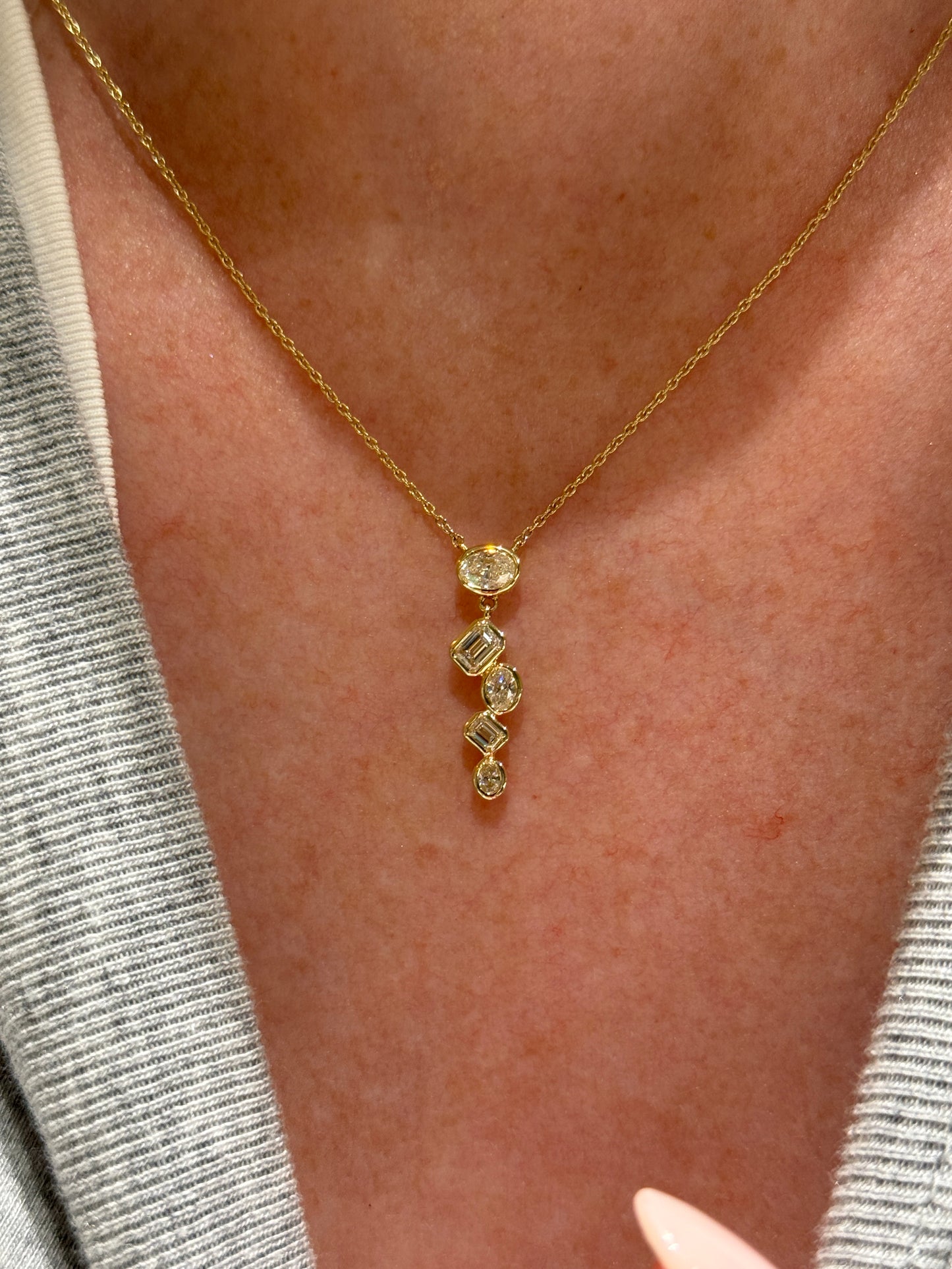 Graduated Oval and Emerald Cut Bezel Set Diamond Pendant