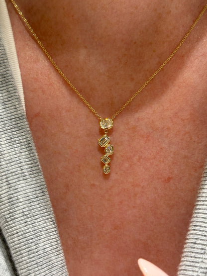 Graduated Oval and Emerald Cut Bezel Set Diamond Pendant
