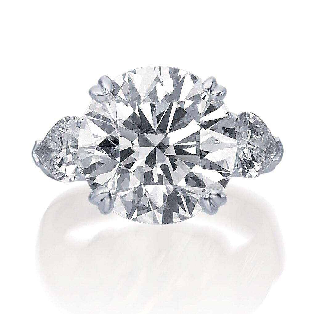 Round Brilliant Cut Engagement Ring with Pear Side Stones